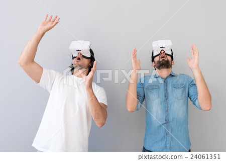 Emotional men using virtual reality device 24061351
