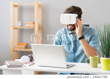 Cheerful man using virtual reality device Cheerful man using virtual reality device 24061799