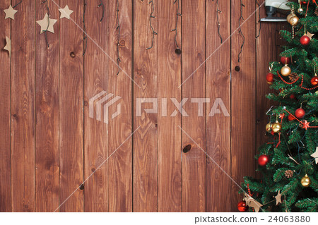 Christmas fir tree on wooden background Christmas fir tree on wooden background 24063880