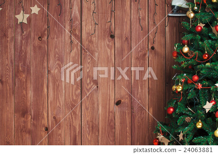 Christmas tree on wooden background Christmas tree on wooden background 24063881