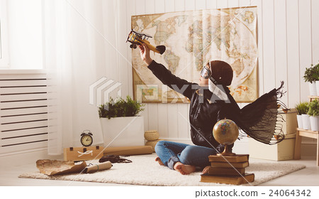 child boy teenager dreams of becoming pilot and  aviator traveli 24064342