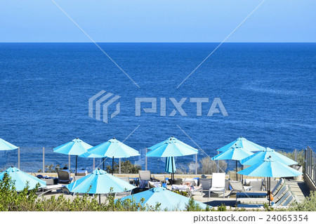 Emerald green umbrella of the former blue ocean and resort pool of the sky 24065354