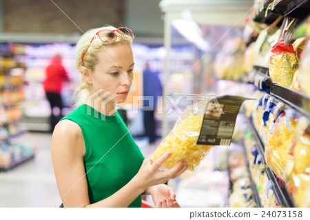 Woman shopping groceries at supermarket. Woman shopping groceries at supermarket. 24073158
