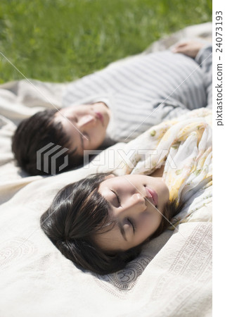 A couple sleeping in the meadow A couple sleeping in the meadow 24073193