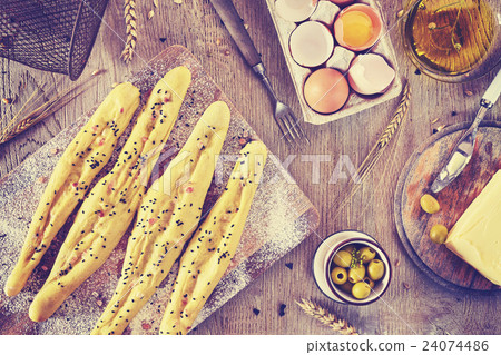 Bread sticks ready for baking. Bread sticks ready for baking. 24074486