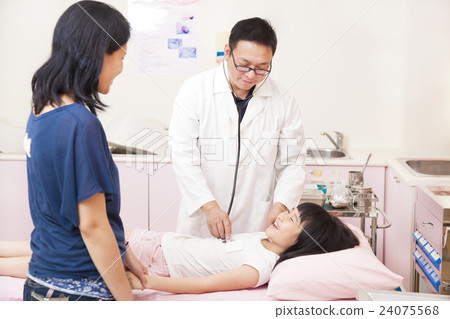 pediatrician examining little girl on the bed 24075568