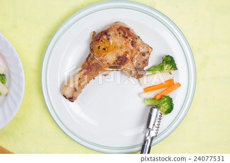 Chef decorated pork chop steak 24077531