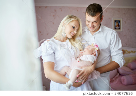 Pretty mother holds her newborn baby  24077656