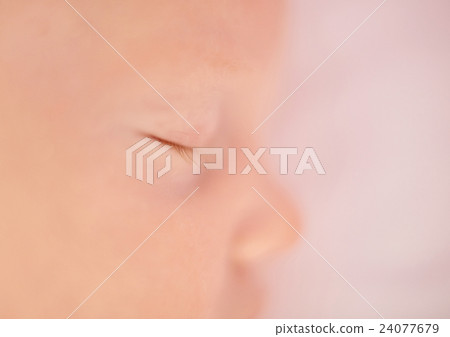 Closeup of delicate baby's eye with tiny lashes 24077679
