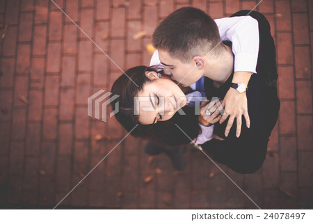 A look from above on the young couple kissing 24078497