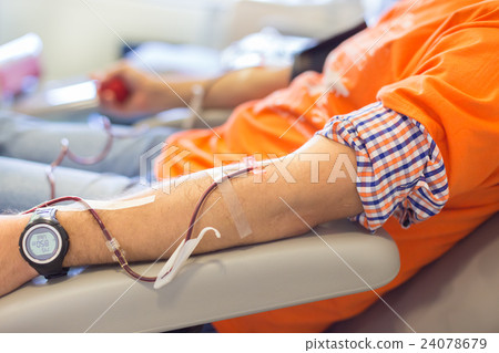 Blood donor at donation. 24078679