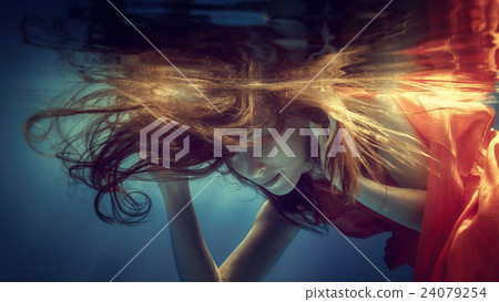 Portrait of a girl in a red dress underwater 24079254
