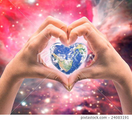 World in heart shape with over women human hands World in heart shape with over women human hands 24083191