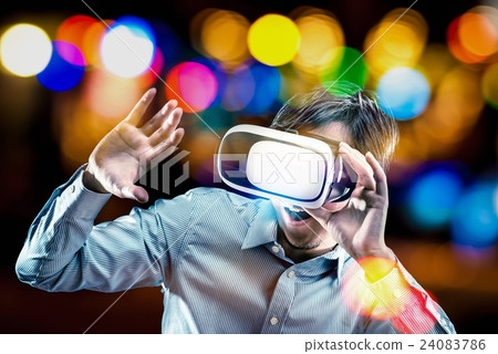 Men wearing VR goggles, virtual reality experience Men wearing VR goggles, virtual reality experience 24083786