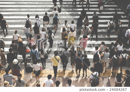 People crossing a pedestrian crossing People crossing a pedestrian crossing 24084267