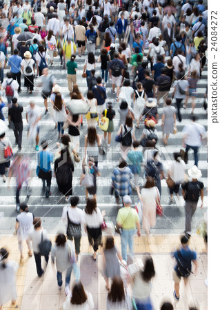 People crossing a pedestrian crossing People crossing a pedestrian crossing 24084272