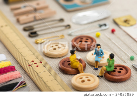 Sewing tools and miniature ladies 24085089