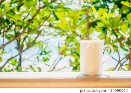 White coffee cup with outdoor view White coffee cup with outdoor view 24090054