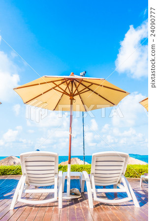 Umbrella and chair 24090777