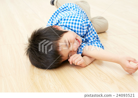 Boys lying down on flooring Boys lying down on flooring 24093521