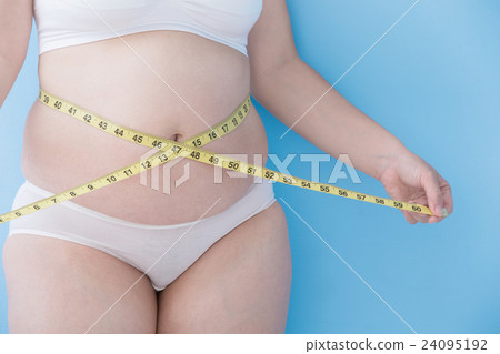 woman take waist ruler amoun woman take waist ruler amoun 24095192
