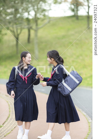 Two walking girls students 24097321