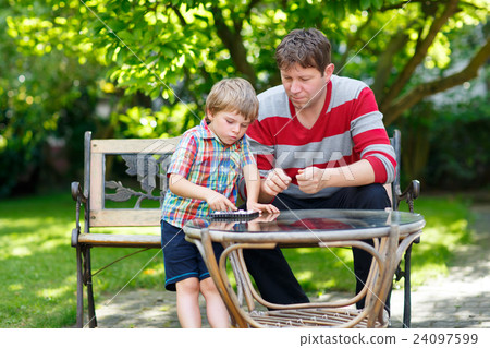 Little kid boy and father playing together 24097599