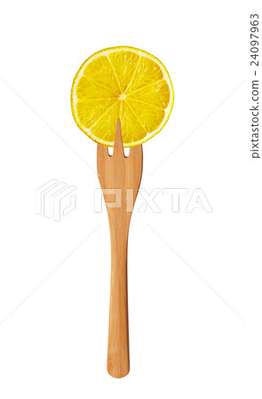 Lemon slice on wooden fork isolated on white 24097963