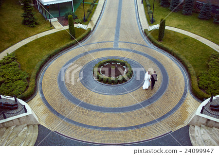 A look from above on the wedding couple walking  24099947