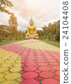 Big Buddha statue In a green park. 24104408