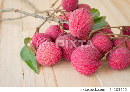 big red Lychee on wood table background 24105323