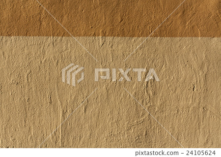 Golden and orange plaster wall texture. Golden and orange plaster wall texture. 24105624