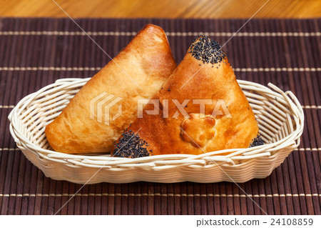 Pasties stuffed meat in basket on bamboo napkin Pasties stuffed meat in basket on bamboo napkin 24108859