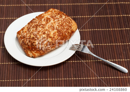 Pie stuffed meat and cheese on bamboo napkin Pie stuffed meat and cheese on bamboo napkin 24108860