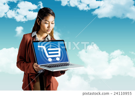 Composite image of smiling businesswoman showing a laptop Composite image of smiling businesswoman showing a laptop 24110955