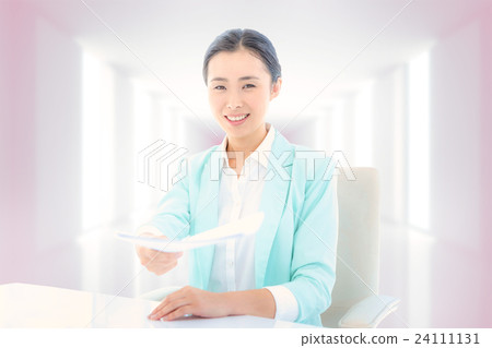 Composite image of smiling businesswoman taking notes 24111131