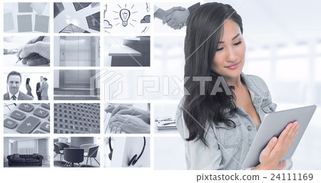 Composite image of asian woman holding tablet 24111169