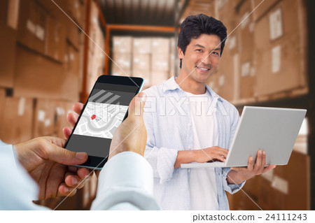 Composite image of hand holding smartphone 24111243