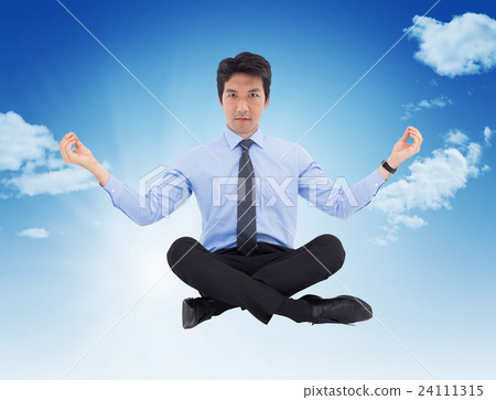 Composite image of asian businessman doing yoga 24111315