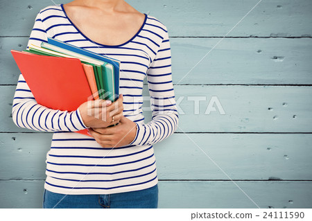 Composite image of mid section of woman holding files 24111590