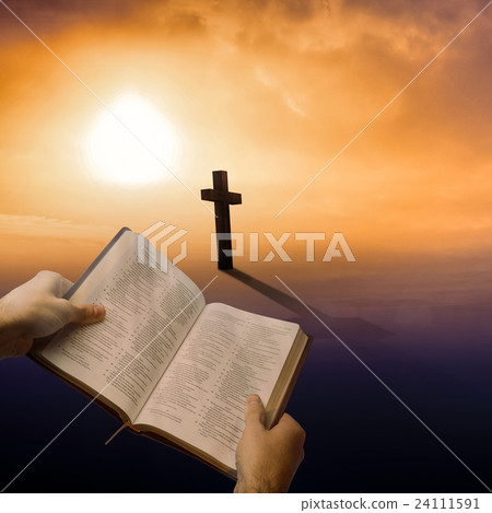 Composite image of man holding a holy bible 24111591