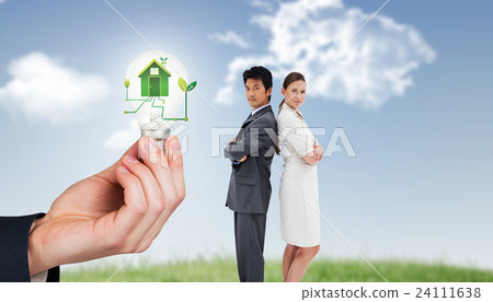 Composite image of portrait of business people standing back-to-back Composite image of portrait of business people standing back-to-back 24111638