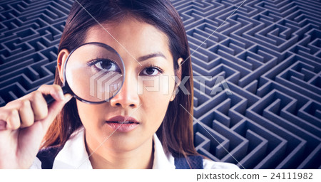 Composite image of businesswoman looking through magnifying glass Composite image of businesswoman looking through magnifying glass 24111982