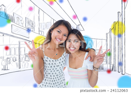 Composite image of two smiling young women making a peace gesture Composite image of two smiling young women making a peace gesture 24112063