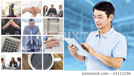 Composite image of man using digital tablet while standing Composite image of man using digital tablet while standing 24112296