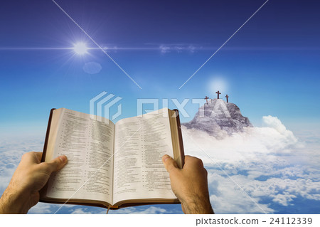 Composite image of man holding a holy bible Composite image of man holding a holy bible 24112339