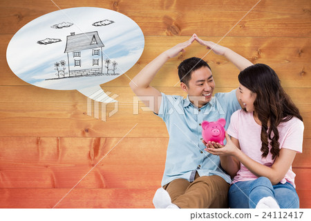Composite image of happy young couple with piggy bak 24112417