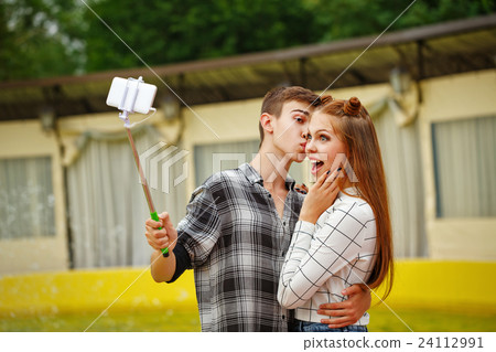 Enamoured teenagers do selfie 24112991