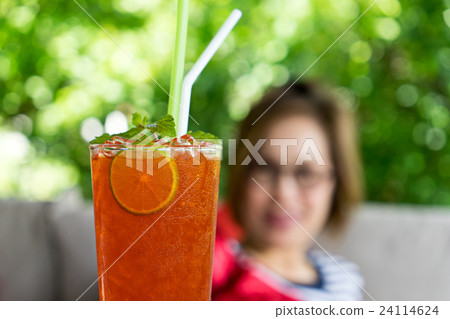 lemon ice tea cold drink with blur woman 24114624