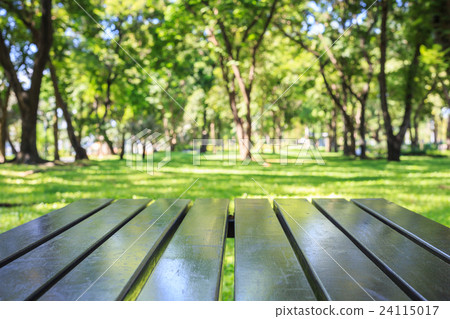 Empty top wooden table and sunny abstract blurred bokeh background 24115017